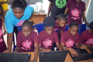 Kids enjoying there new computers.