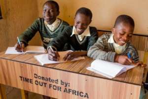 Kids enjoying the newly donated tables