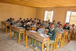 A classroom with donated table and students