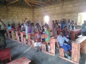 Kids enjoying there newly donated Tables/Chairs