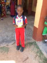 Issac showing off his note books