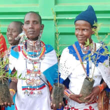 Community members showing seedlings
