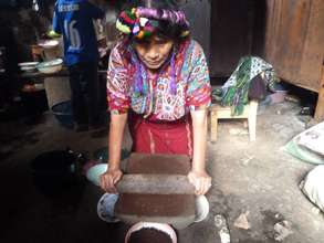 Grinding corn.