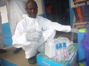 A medical worker examines donated supplies