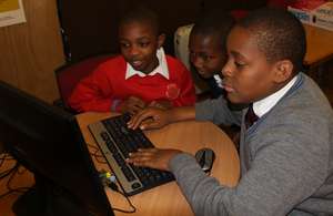 Boys exploring the functionality of Raspberry Pi