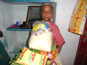 destitute elderly woman receiving month groceries