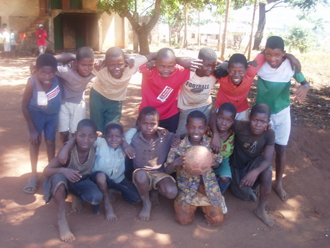A team of young boys from Gurue's polo 9, pose for a serious tea