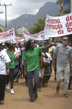 Maria with the Ambassador lead a parade in Gurue.