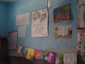 Posters and books.At the centre, the poem on kites