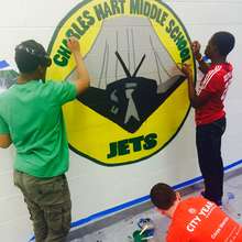 DC high school students rehabilitate an old mural.