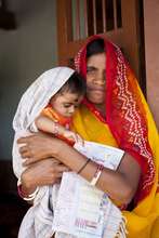 Mother with her child in an immunization camp