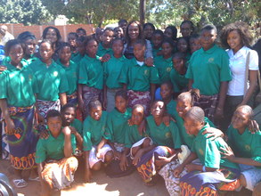 The scholarship receipients from both years with Maria Mutola.
