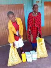 Maria and her mother receiving food gift