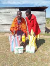 Felister and her mother receive food donation