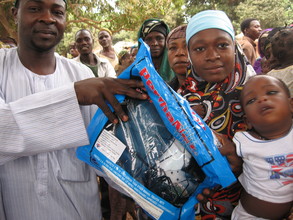 A benefiting family shows off their ITN