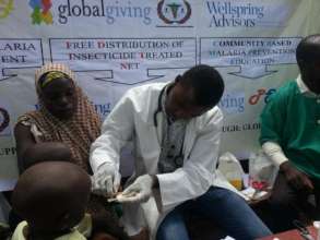 A suspected malaria patient undergoing RDT testing