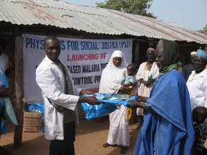 Village head of Faje receiving the ITNs from PSJ team on behalf
