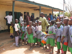 School children lined up to receive to recieve antimalaria chemo
