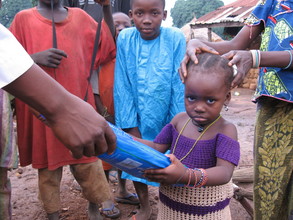 An OVC recieving ITN from PSJ malaria in sabonriji
