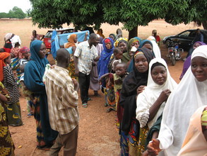 Women line up to receive treated nets at sabon-rijia village
