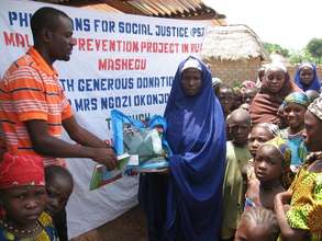 A pregnant woman receiving ITN at T-magai village