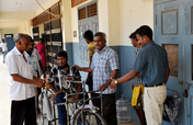 Tricycles,hearing aids to disable school children