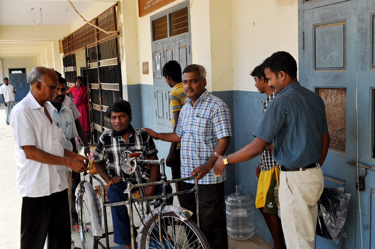 Tricycles,hearing aids to disable school children