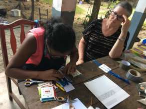 Lalaina learns how to set-up cards for weaving