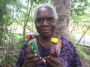 Margaret with her carved and painted birds
