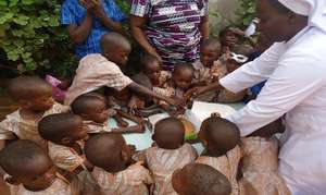 Children in front of a cake