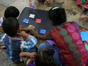 Pasting small kites to make a collage
