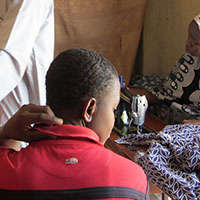 Mustapha Muhammed working at the shop