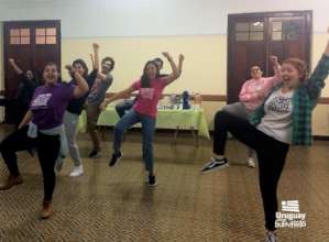 Volunteers learn a Flash Mob dance