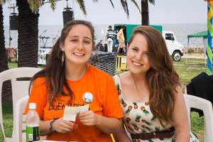 Chloe and Emily working at an event