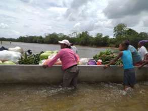 Women guide the boat to shore