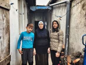 Muhamet and Shkurta with their mother, Vahide