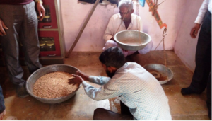 Village committee doing quality check and weighing