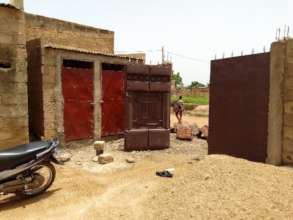 Construction of toilets, fixture of doors and gate
