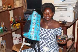 Artisan Leonie supports her 3-year old son
