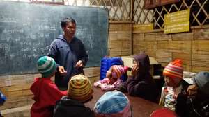 Sai Oo teaching the children of his community