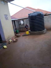 Girls collecting water from the given water tank