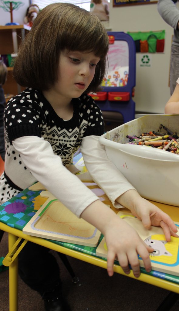 Child enjoys her puzzle activity