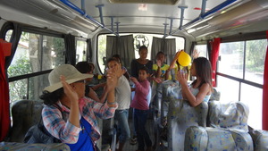 Inside the bus a farewell song.
