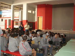 Students listen attentively.