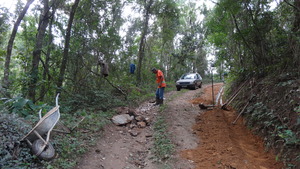 Filling holes on the road.