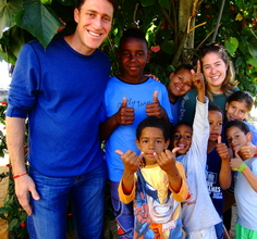 Melissa and I and children outside of Valença