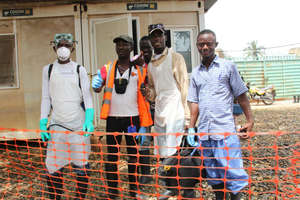 Production team with health care workers