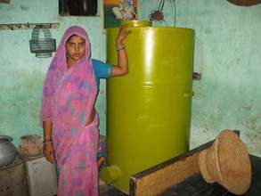 Sunita Devi with her storage bin