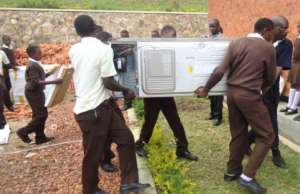 NVSS students carrying in lab equipment