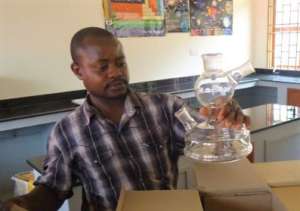 NVSS teacher unpacking lab equipment